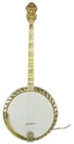 Fine Bacon & Day Silver Bell Montana four string banjo, inscribed on the brass ring guard B & D.