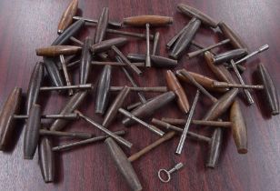 Twenty-eight various piano tuning keys with turned wooden handles (28)