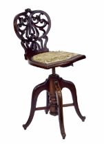 Good late Victorian mahogany violoncello chair, the pierced foliate back over a solid shield