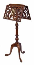 Good Victorian mahogany adjustable duet music stand, the ledges pierced with scrolling foliage