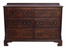 Georgian oak mule chest of drawers, with a hinged lid over two short dummy drawer fronts and four