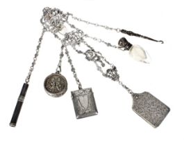 Good silver chatelaine, the three part pierced buckle decorated with a putti figure and urns