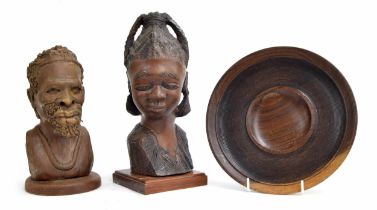 Two carved wooden figural bust sculptures of an African tribal lady and gentleman, tallest 15" high;