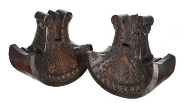 Pair of South American Mapuche ceremonial carved stirrups, 19th century, of anchor form decorated