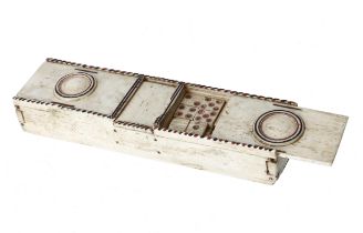 A Napoleonic prisoner of war bone games box, with three slide covers, containing dominoes, two