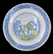 Dutch Delft pottery plate, decorated with a blue lion on a white ground highlighted in yellow to the