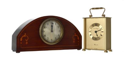 Edwardian inlaid mahogany 8 day mantel clock, the 3.5" dial in an arched case with bun feet, 10.5"