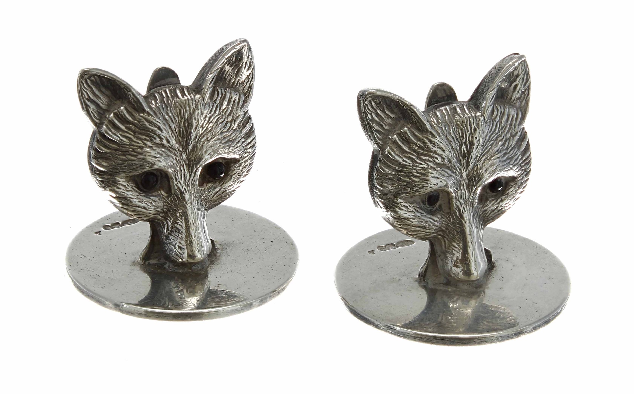Pair of novelty silver fox menu holders by Sampson Morden & Co., with glass eyes, hallmarked Chester