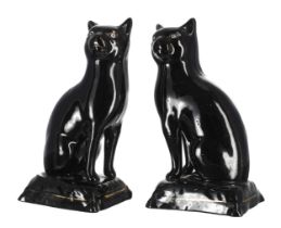 Pair of Staffordshire Jackfield porcelain cat figures, modelled seated on cushion bases with gilt