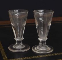 Pair of Georgian deceptive ale glasses, the conical deception bowls over short knopped stems, both