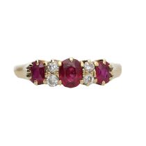 18ct yellow gold claw set ruby and diamond ring, with three oval rubies 0.90ct approx in total,