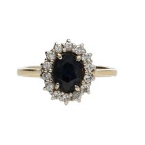 18ct yellow god sapphire and diamond oval cluster ring, the sapphire 0.90ct approx, round