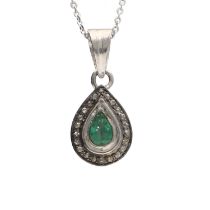 Pretty pear shaped emerald and round brilliant-cut diamond halo silver pendant on a silver chain,