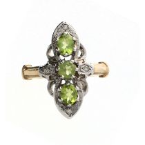 Fancy 9ct white and yellow bold elongated vintage style ring, set with three peridots and round-