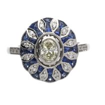 Stylised modern 18ct white gold oval dress ring set, with a central oval diamond surrounded by