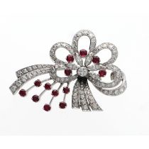 Attractive ruby and diamond white metal bow brooch, with thirteen round-cut rubies, round and