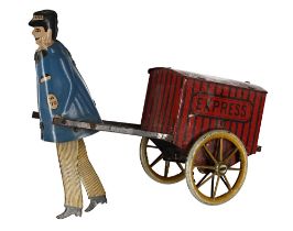Vintage German Lehman tin-plate clockwork "Express" porter, the figure with blue coat and striped