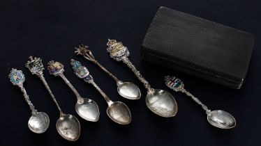 Group of seven Sterling and Continental silver souvenir teaspoons with enamelled crested finials;