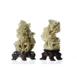 Pair of Chinese carved soapstone floral sprays, the green coloured displays mounted on natural