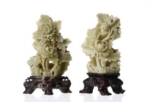 Pair of Chinese carved soapstone floral sprays, the green coloured displays mounted on natural