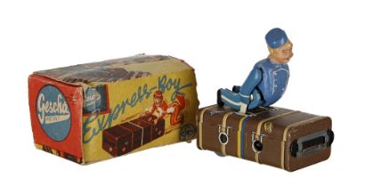 Vintage German Gescha Patent clockwork tin plate 'Express-Boy' porter riding a suitcase novelty