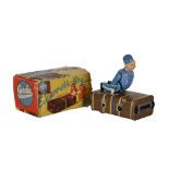 Vintage German Gescha Patent clockwork tin plate 'Express-Boy' porter riding a suitcase novelty