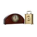 Edwardian inlaid mahogany eight day mantel clock, the 3.5" dial in an arched case with bun feet,