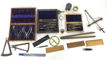 Two cased sets of antique writing/drawing instruments; together with a cased set of plier tools
