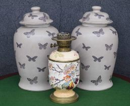 Pair of India Jane butterfly pattern pottery jars with covers, 16.5" high; together with a Duplex