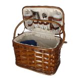 Vintage wicker picnic hamper, 11" high; the interior lined and fitted with contents including