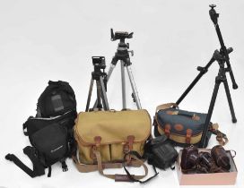 Group of assorted camera bags and leather carry cases; together with three metal camera tripods by