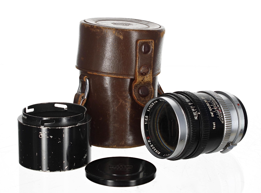 Nikon Nippon Kogaku Nikkor-P.C 1:2.5 f=10.5cm lens, no. 817317, with lens cap, hood and leather
