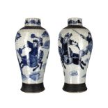 Pair of Chinese blue and white Nanking crackle glaze baluster porcelain urns, decorated with