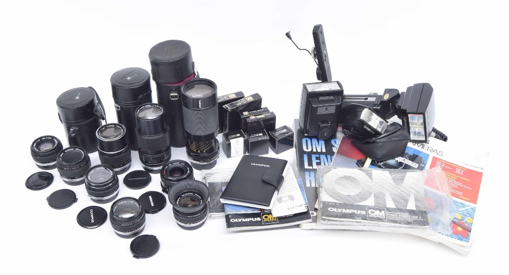 Group of Olympus camera equipment and lenses, including; lens Auto-Zoom 1:4 f+75-150mm, made in