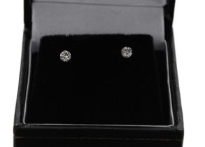 Pair of 18ct white gold round-cut diamond solitaire stud earrings, 0.20ct approx in total, post