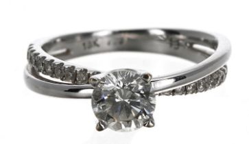 Modern 18ct white gold solitaire diamond crossover design ring, round brilliant-cut, 0.65ct