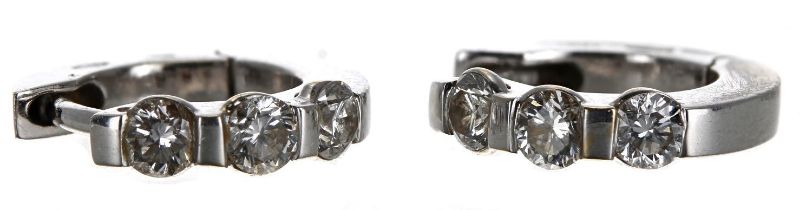 Small pair of 18ct white gold diamond earrings, each with three round brilliant-cut diamonds, 3.2gm,