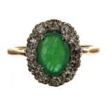 Attractive 18ct yellow gold oval-cut emerald and eight-cut diamond halo scalloped ring, the