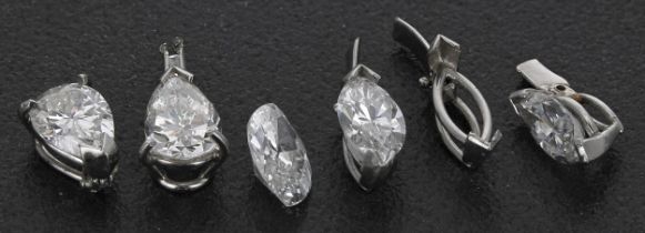 Three marquise diamond pendants, each 0.40/0.50ct approx (one loose); with two pear shapes diamond