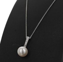 9ct white gold round freshwater pearl and diamond pendant on a 9ct white gold chain, diamonds 0.