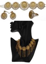 High grade yellow metal oval coin style necklet, bracelet, ring and earrings, 79.2gm (6)