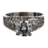 Impressive 18ct white gold brilliant-cut diamond ring with fancy diamond leaf shoulders, the