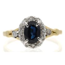 18ct yellow gold sapphire and diamond oval cluster ring, the sapphire 0.60ct approx, width 10mm, 3.