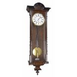 Faux walnut and ebonised single weight Vienna regulator wall clock, the 7" white dial within a