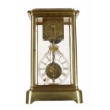 Rare and unusual brass four glass two train mantel clock, the movement housed to the top of the