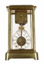 Rare and unusual brass four glass two train mantel clock, the movement housed to the top of the