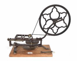 Good antique steel and cast iron wheel cutting engine, mounted upon a rectangular canted pine