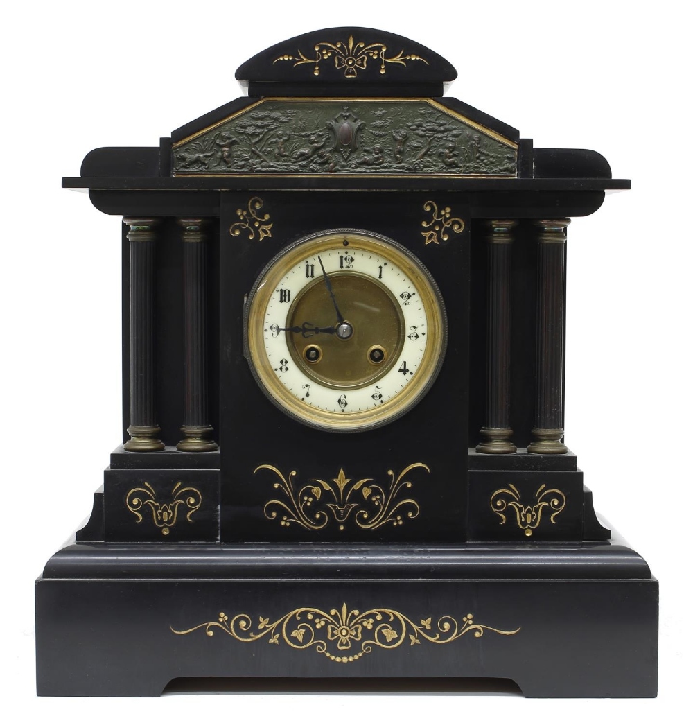 French black slate two train mantel clock striking on a gong, the 3.75" cream chapter ring enclosing