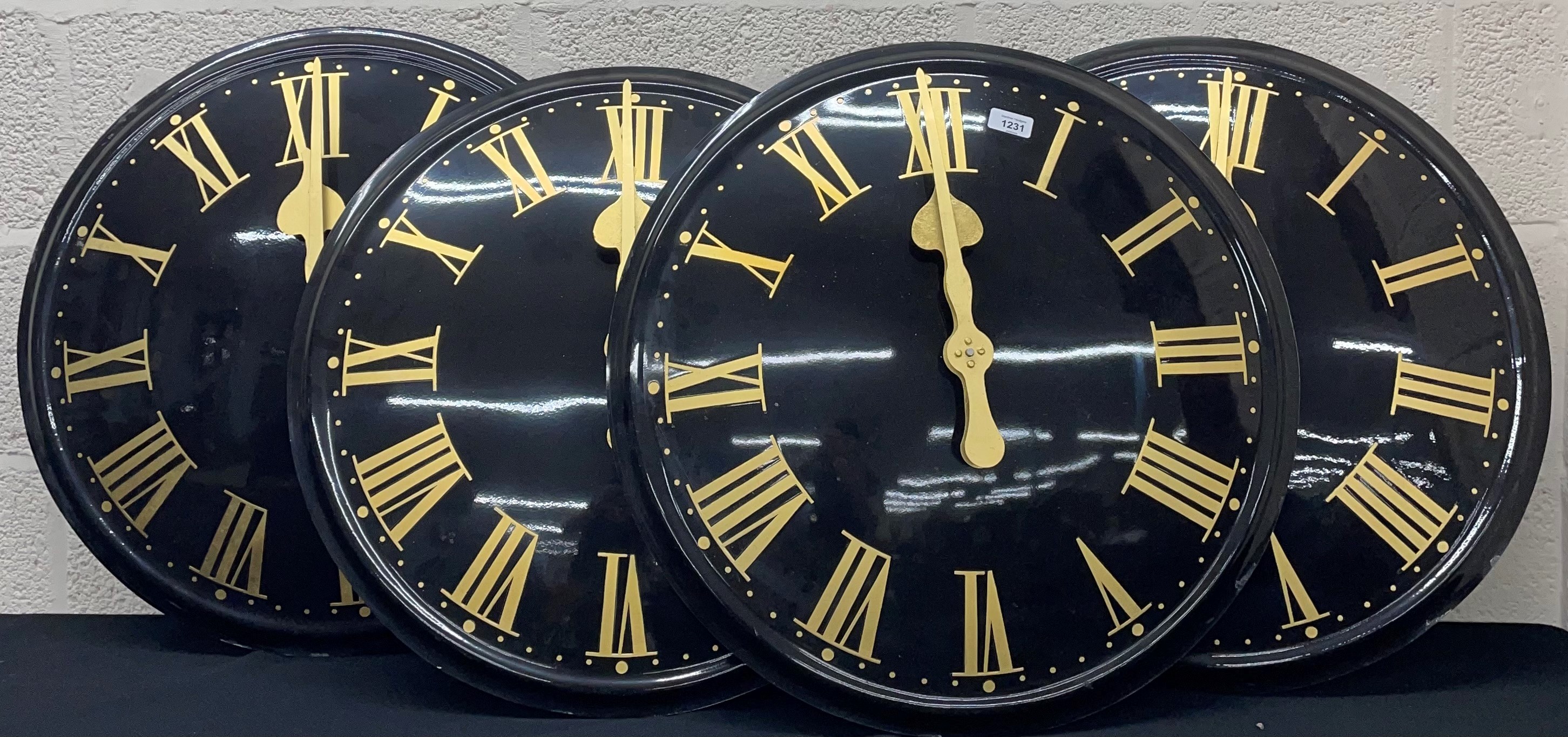 Four contemporary 24" electric turret clock dials, retailed by Meadows & Passmore, black fibreglass