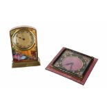 Small brass desk timepiece decorated with a musician and two ladies in a garden, 3.5" high; also